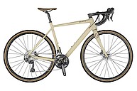 Ein creme farbenes Gravelbike des Herstellers Scott